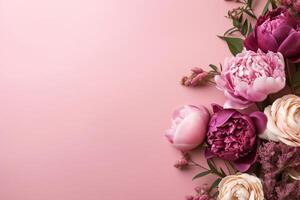 Roses on a pink background with copy space. Abstract natural floral frame layout with text space. Romantic feminine composition. photo