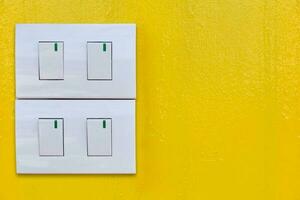 On-off switch against yellow background photo