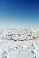 winter views from the mountain slopes of Beldersay in Sunny clear weather with blue skies photo