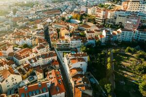 Aerial drone view of apeople at two viewpoints overlooking Lisbon, Portugal at sunset photo