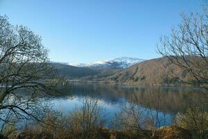 Nordfjord in Norway. View of mountains covered with snow. Wilderness in Scandinavia photo