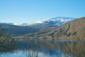 Nordfjord in Norway. View of mountains covered with snow. Wilderness in Scandinavia photo