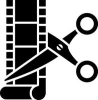 Glyph film strip with scissors icon or symbol. vector