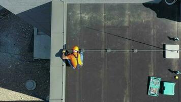 Aerial View of Metal Roof Lightning Protection Construction Building by Worker video