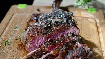 Barbecue Time. Men Eating Piece of Tom-A-Hawk Steak. video