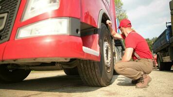 Truck Driver in His 30s Making Quick Tires Check. Transportation Industry Footage. video