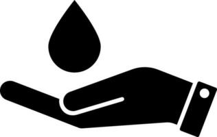 Essential oil drop for spa massage falling on an open hand glyph icon. vector