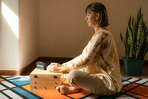 Scientific medicine. Female patient receiving torsion waves, flowing in a sacred geometric spiral phi. Kozyrev photo