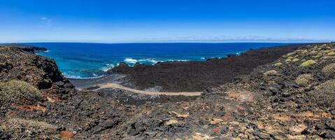 Panoramic picture over the black beach Playa del Paso near El Golfo on Lanzarote photo