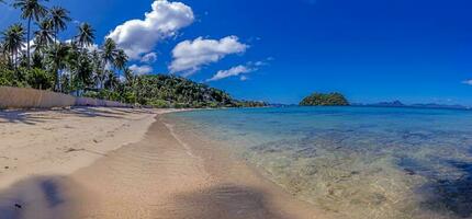 Impression of the paradisiacal Maremegmeg beach near El Nido on the Philippine island of Palawan during the day photo