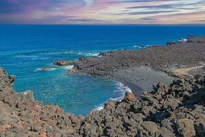 Picture over the black beach Playa del Paso near El Golfo on Lanzarote photo