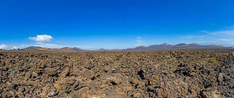 Panoramic view over the barren volcanic Timanfaya National Park on Lanzarote photo