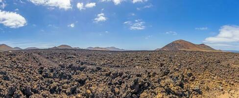 Panoramic view over the barren volcanic Timanfaya National Park on Lanzarote photo