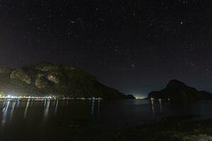 Night shot over the harbor and bay of El Nido on the island of Palawan photo