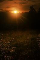 Picturesque golden hour sunset with mountain photo