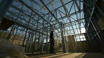 Steel Frame of the Building and Contractor Worker. The Construction Site. video