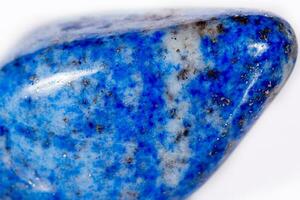 Macro mineral stone blue lapis lazuli afghanistan on white background photo