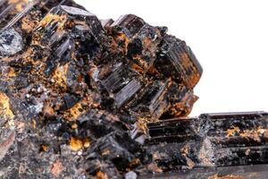 macro mineral stone sherle, schorl, black tourmaline on white background photo