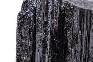 macro mineral stone sherle, schorl, black tourmaline on white background photo