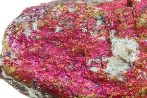 Macro mineral stone Chalcopyrite in the rock on a white background photo