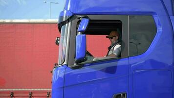 Caucasian Truck Driver in His 30s in the Modern Euro Semi Truck video