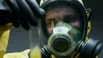 Scientist In Hazmat Gear Observes Reaction Of Chemicals. video