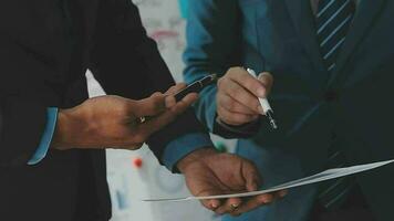 Financial analysts analyze business financial reports on a digital tablet planning investment project during a discussion at a meeting of corporate showing the results of their successful teamwork. video