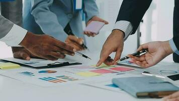 Group of coworkers in formal wear sitting at table in conference room and arguing about project of company development during meeting video