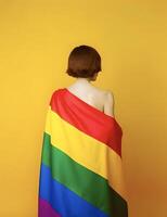 Girl wearing rainbow flag. Concept of LGBT pride. . photo