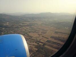 interesting views from the airplane window on a warm summer day photo