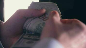 Caucasian Business Owner Counting One Hundred Dollars Bills in His Hands video