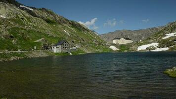 Great St Bernard Pass Road in the Switzerland. Saint Bernard Lake and the Country Border Building video