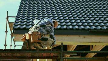 House Construction Theme. Caucasian Contractor in His 30s Working on a Scaffolding. video