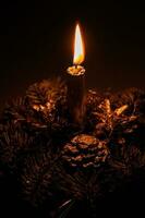 elegant Christmas headdress with a candle lit in the ambient lighting photo