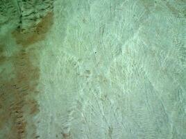 natural limestone background with traces of water from Pamukkale in Turkey in close-up photo