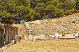 old ruins of the ancient temple of Athena in Priene in Turkey on a hot summer day photo