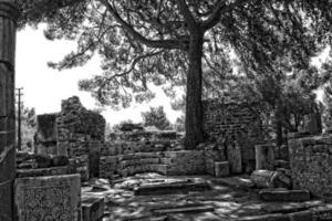 old ruins of the ancient temple of Athena in Priene in Turkey on a hot summer day photo