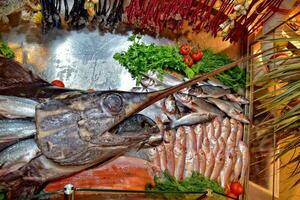 tasty saltwater fish lying on display in a shop or restaurant photo