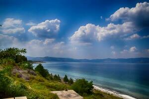 summer landscape of turkish lake Salda with turquoise water, blue sky and white beach photo