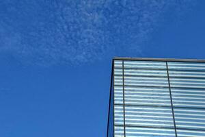 modern original fragments of architecture against the blue sky creating an interesting background photo