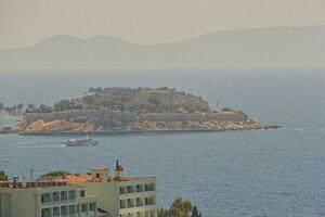 Turkish port city of Kusadasi on the Mediterranean Sea on a warm summer sunny day, photo