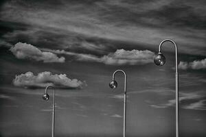 blue sky with white clouds and lanterns on a warm sunny day photo