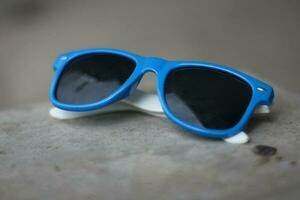 glasses with blue frames with black glasses photo