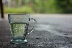 mineral water in a glass that is used for coffee. photo