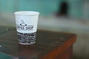 black coffee in a paper cup. photo