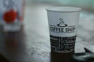 black coffee in a paper cup. photo