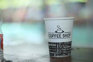 black coffee in a paper cup. photo