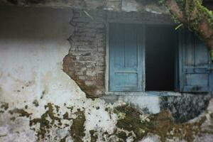 unique and vintage old window design, wall spacing, walls worn out by time. photo