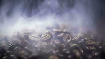 Coffee beans roasting with smoke,  selective focus, and soft focus. photo