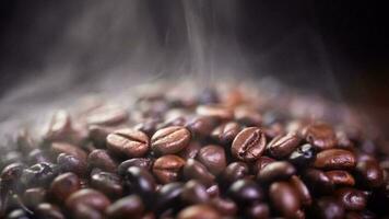 Coffee beans roasting with smoke,  selective focus, and soft focus. photo